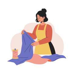 Woman sorting fabric scraps while smiling in a cozy workspace  