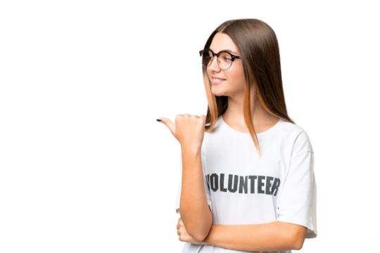 Teenager volunteer caucasian girl over isolated background pointing to the side to present a product
