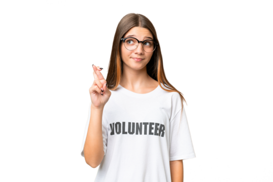 Teenager volunteer caucasian girl over isolated background with fingers crossing and wishing the best