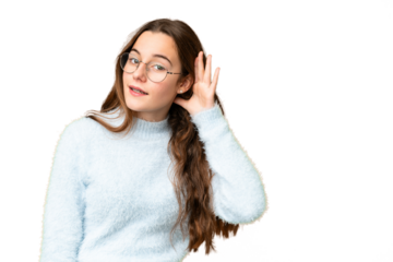 Teenager girl over isolated chroma key background listening to something by putting hand on the ear