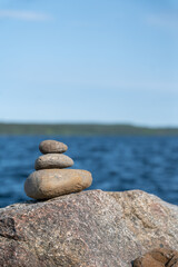 A Tranquil Waterscape Rock Balancing and Serene Ocean View