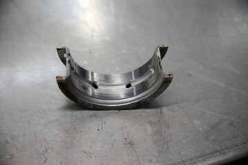 worn crankshaft bearing on a metal table