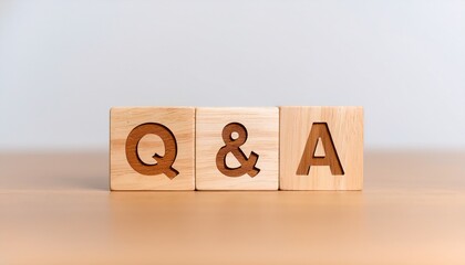 q and a concept n wooden cube with faq symbols for business and social networks