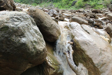Water falls in river and low flow water.