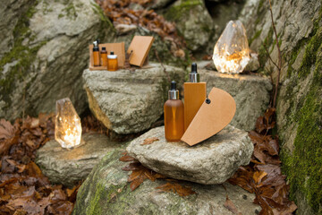 Tranquil ecommerce brand photoshoot featuring natural skincare products displayed on rocks surrounded by autumn leaves and illuminated by soft lights. warm tones create serene atmosphere