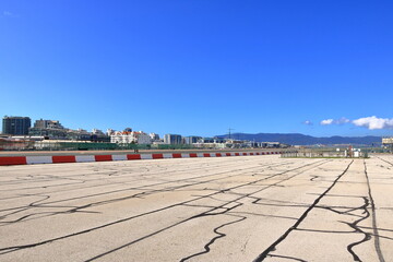 the empty runway at Gibraltar Airport with view to the sea