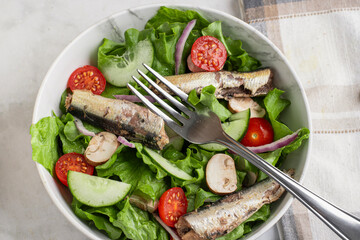 garden salad  top with  mushrooms and sardines