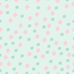 Seamless vector floral pattern in pastel pink and green on a mint background. Soft rounded petals create a light, minimal look. Perfect for textiles, packaging, and more