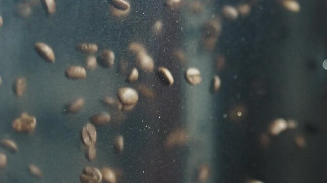 Dark background highlighting roasted coffee beans cascading with dynamic texture, revealing intricate movement and rich agricultural artistry