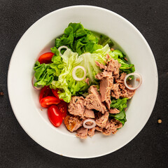 Tuna salad green leaf lettuce, canned tuna, tomato fresh delicious gourmet food background on the table rustic food top view copy space keto and paleo diet vegetarian food pescetarian diet