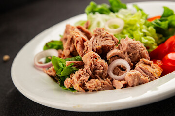 Tuna salad green leaf lettuce, canned tuna, tomato fresh delicious gourmet food background on the table rustic food top view copy space keto and paleo diet vegetarian food pescetarian diet