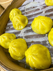 Steamed Yellow Dumplings in Bamboo Steamer