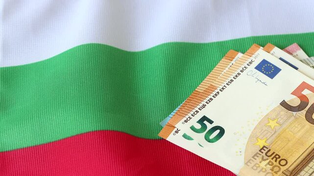 Bulgaria in the Eurozone. Business and financial concept. Flag of Bulgaria and euro banknotes. Replacing the Bulgarian lev with the common European currency