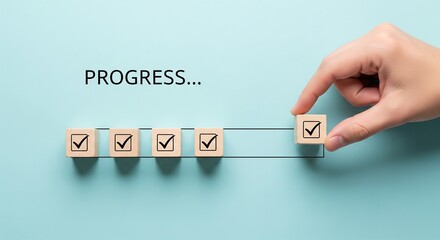 Checklist and task progress tracking concept. A hand placing the final checkmark on wooden blocks in a progress bar, task completion, productivity, goal setting, and efficient project management. 