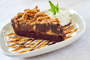 chocolate peanut butter pie drizzled with chocolate and caramel sauce