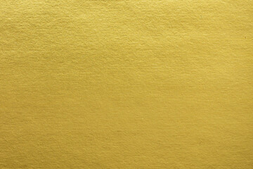 Obraz na płótnie Canvas Gradation gold foil leaf shiny matt with sparkle yellow metallic texture background. Abstract paper glitter golden glossy for template. top view.