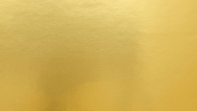Gradation gold foil leaf shiny matt with sparkle yellow metallic texture background.
Abstract paper glitter golden glossy for template.
top view.