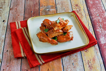 oven baked country style ribs in tossed with a spicy bbq sauce