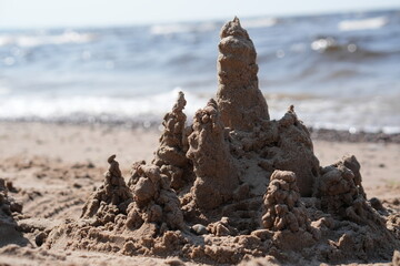 Sandcastle with Spires on a Beach by the Water