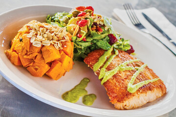 pan roasted salmon topped with wasabi served with sweet potato hash and a side salad