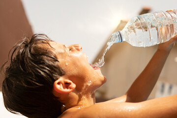 Drinking bottled water due to heat stroke in a summer heat wave