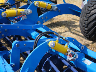 Fototapeta premium Close-up of hydraulic system of agricultural equipment machine. New models of agricultural equipment.