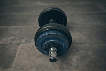 High angle view of dumbbell on floor. Horizontal image.
