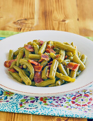 green bean casserole topped with crispy bacon