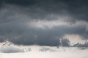 Dark stormy clouds before heavy rain. Overcast sky, dramatic bad weather.