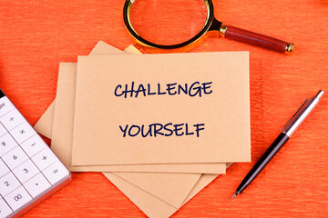 Believe in yourself, overcoming challenges concept. CHALLENGE YOURSELF text written on an envelope...