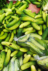 Pile of Fresh Green Cucumbers at Market