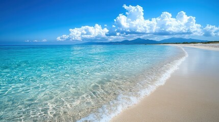 A pristine beach with clear turquoise water, gentle waves, white sand, under a bright blue sky with fluffy clouds and distant mountains.