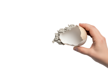 Hand Holding Cracked Egg: A close-up shot of a hand gently holding a cracked eggshell filled with gray rock fragments, embodying fragility and new beginnings.