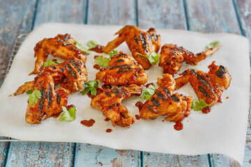 grilled chicken wings tossed in a sticky BBQ glaze