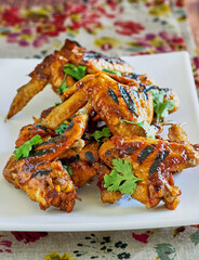 grilled chicken wings tossed in a sticky BBQ glaze