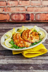 whiskey glazed, cast iron seared fish fillets with fresh lemon and parsley
