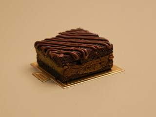 Freshly baked pastry with topping, on beige background