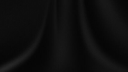 piece of black fabric with a fine texture and wrinkles or folds that create shadow and highlight effects
