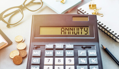 Calculator Displaying the Word Annuity on a Business Finance Desk