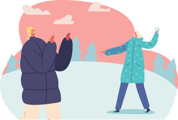 Couple playing snowballs on street