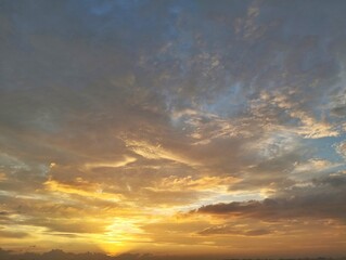 Dramatic sunrise sky view with clouds in summer season 