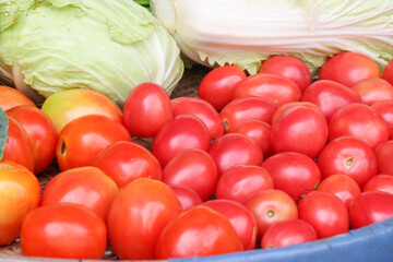 Ripe tomatoes in a fresh vegetable shop