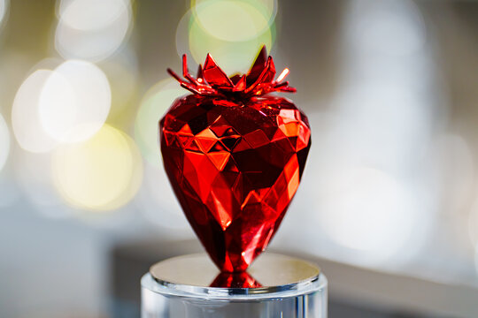 Red metal strawberry sculpture