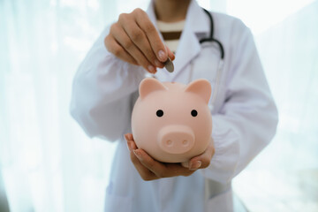 Doctor using stethoscope to examine a piggy bank, symbolizing the savings in medical care and...