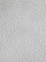 Background of the kamprot wall texture is light gray. Roughcast wall texture is a light gray color. Uneven surface of the rough plaster layer on the wall gives an artistic impression for decoration.