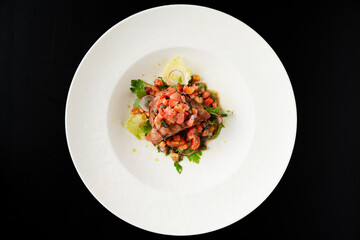 Grilled Meat with Tomato and Herb Salsa on White Plate