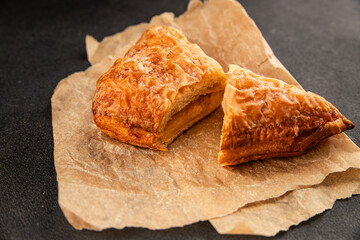 Triangle cake almond puff pastry sweet dessert fresh delicious gourmet food background on the table rustic food top view copy space