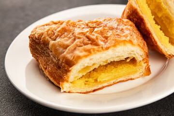 Triangle cake almond puff pastry sweet dessert fresh delicious gourmet food background on the table rustic food top view copy space