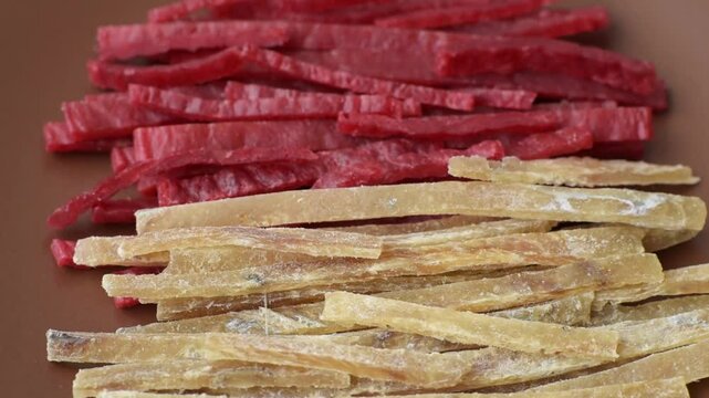 A set of jerky or snacks of chicken and fish with salt and spices. Dried beer snacks
