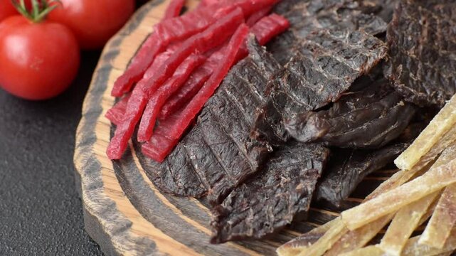 A set of jerky or snacks of beef, chicken and fish with salt and spices. Dried beer snacks
